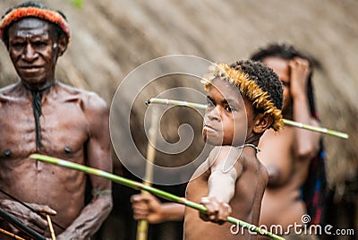 Children Dani tribe learning to throw a spear. Editorial Stock Photo